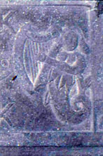 Detail of the mermaid on the right side of the Kilcoy Castle mantle carving.