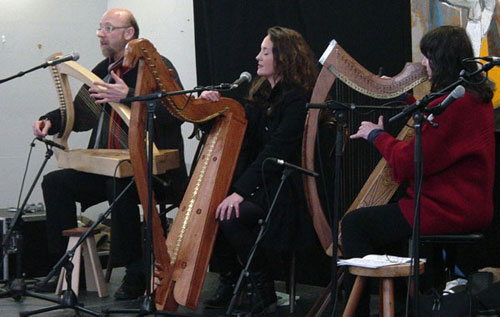 A photograph of three harpers on stage for the lunchtime recital