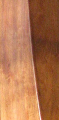 Photograph of a section of a harp made out of Cherry