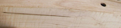 Photograph of a section of a harp made out of Hard Maple